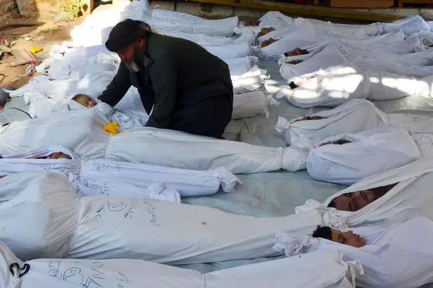 Man-with-dead-child-syria-chemical-weapons-attack-2199934.jpg